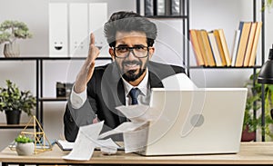 Stressed businessman work at unpaid bank debt, doing paperwork, planning budget, throws paper bills