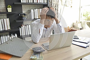 Stressed businessman working under pressure