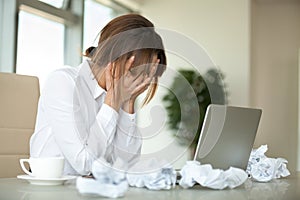 Stressed businesswoman feel unmotivated to write business report