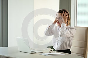 Stressed businesswoman feeling despair suffering from overwork