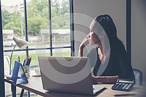 Stressed businesswoman Frustrated and upset in businessn working on laptop,