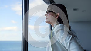 Stressed businesswoman looking window closeup. Tired manager consider problems