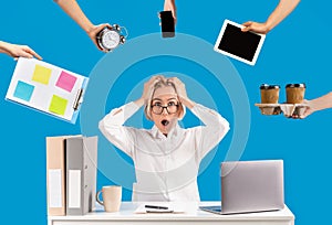 Stressed businesswoman surrounded by hands with gadgets, watch, coffee, schedule