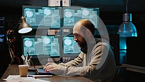 Stressed IT coder hacking security system on computer