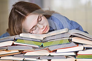 Stressed college student tired of hard learning with books in exams tests preparation