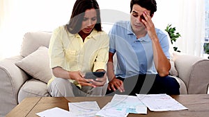 Stressed couple because of bills to pay
