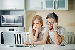 Stressed couple in trouble, have no money to pay debts, to pay rent