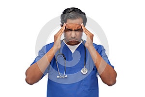 stressed doctor or male nurse having headache