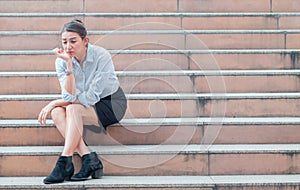 stressed employee, businesswoman, holding his forehead in stress After fired from work and failed in busines