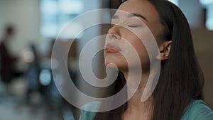 Stressed employee calming down at office closeup. Woman having nervous breakdown