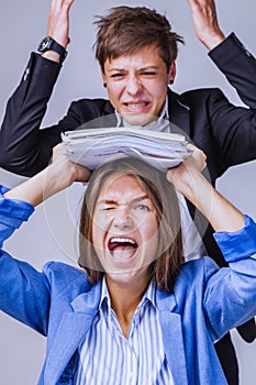 Stressed employee intern suffering from gender discrimination and unfair criticism of angry male boss. Vertical image