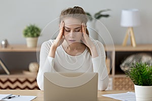 Stressed exhausted young woman tired from computer work feeling fatigue