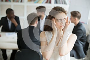 Stressed female corporate employee having migraine during briefi