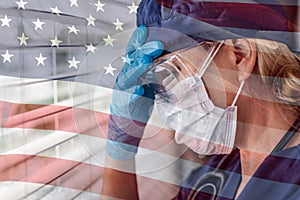 Stressed Female Doctor or Nurse On Break At Window Wearing Medical Face Mask and Goggles With Ghosted American Flag