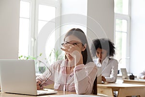 Tired female worker messaging eyes trying to relieve pain photo