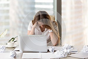 Stressed female entrepreneur in creativity crisis