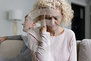 Stressed frustrated middle aged wife crying after conflict
