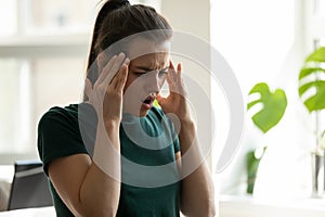 Stressed frustrated millennial woman manager making critical mistake in work