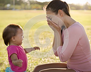 Stressed frustrated mother with her crying baby. Postpartum depression