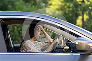 Stressed girl with headache drive car. Frustrated displeased young female driver suffer from illness