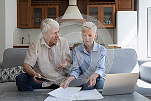 Stressed grandparents do paperwork find lack of money on account