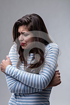 Stressed harassed fearful young woman