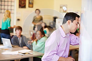 Stressed High School Teacher Trying To Control Class