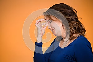 Stressed housewife middle aged woman with headache photo