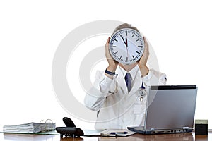 Stressed male doctor in office under time pressure