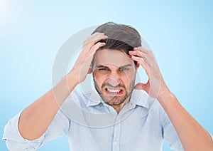 Stressed man against blue background