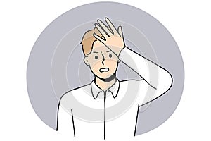 Stressed man make hand gesture remembering something