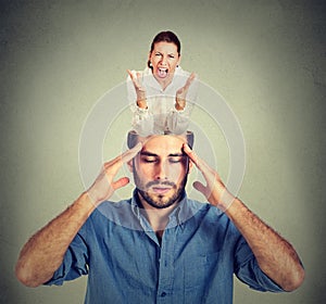 Stressed man with open head and screaming woman inside his brain