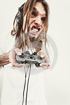 Stressed man playing on pad