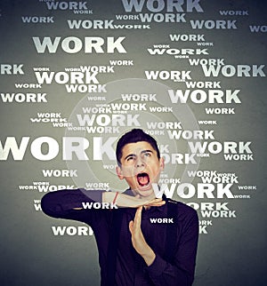 Stressed man showing time out overwhelmed by long working hours