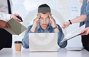 Stressed mixed race businessman being nagged by colleagues. Irritated and annoyed hispanic professional man feeling