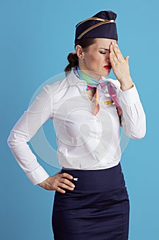 stressed modern air hostess woman on blue