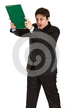 Stressed modern businessman brandishing folder