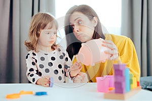 Stressed Mom Teaching her Child about Money and Savings