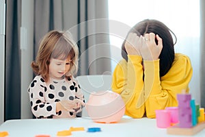 Stressed Mom Teaching her Child about Money and Savings