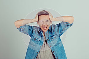 Stressed natural looking woman boy alike with hands on her head isolated on white background. Horizontal image, studio shot