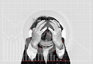 Stressed out businessman, with downward business graphs. Failure stock market and loss business investment profit concepts