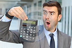 Stressed out businessman smoking four cigarettes at the same time