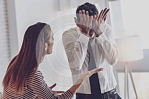 Cheerless nervous man covering his eyes photo