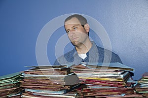 Stressed out man at work staring off into space.