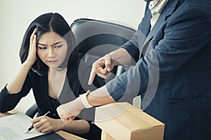 Stressed out person with boss counting deadline.