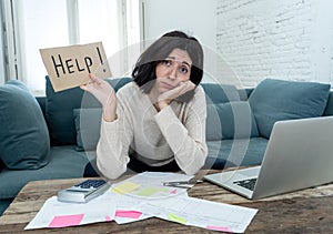 Stressed and overwhelmed young woman accounting home finances paying bills asking for help