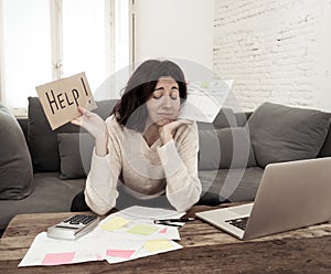 Stressed and overwhelmed young woman accounting home finances paying bills asking for help