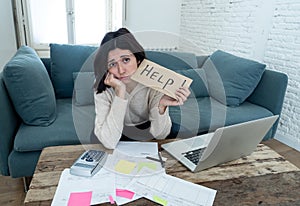 Stressed and overwhelmed young woman accounting home finances paying bills asking for help