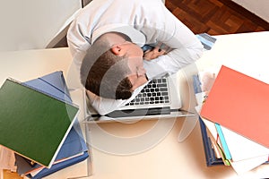 Stressed and Overworked Businessman sleeping
