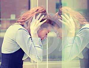 Stressed sad young woman outdoors. Urban life style stress